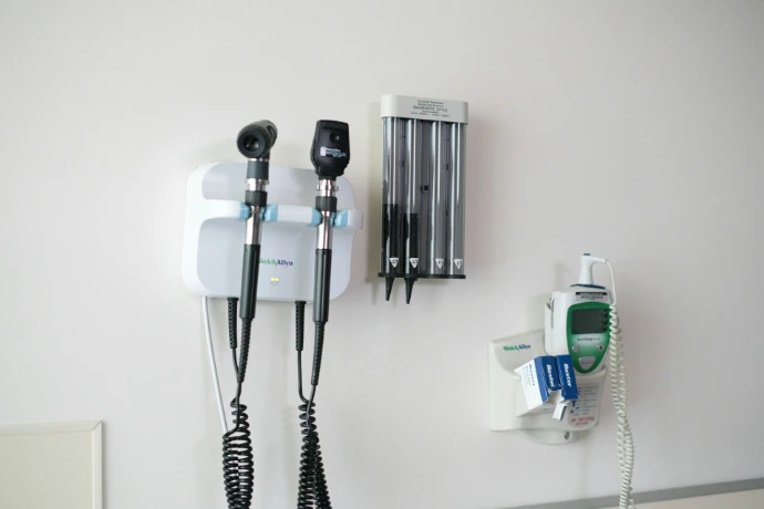 Medical diagnostic tools mounted on a wall.